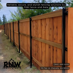 A long wooden privacy fence with sturdy black metal posts, showcasing quality work by PNW FENCE in Lewiston, ID.