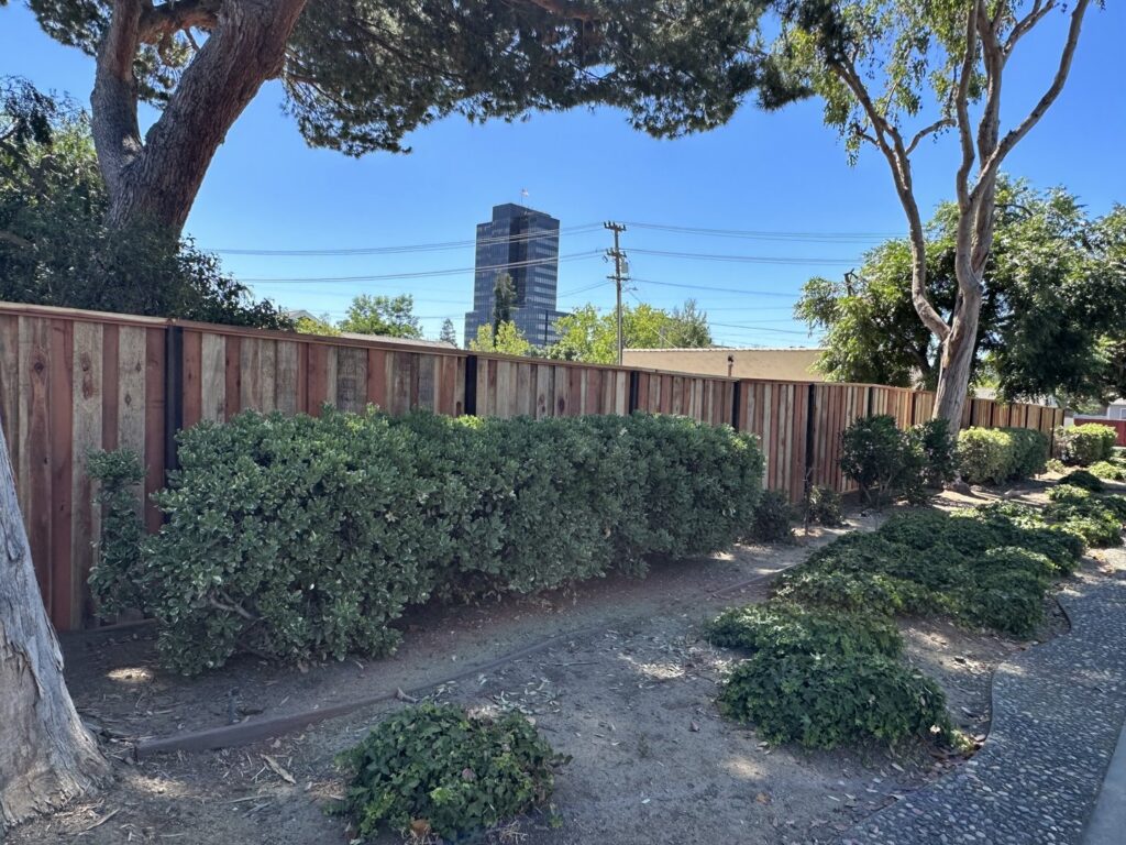 A long wooden privacy fence installed along a commercial or large residential property by Superior Fence & Rail in San Jose, CA.