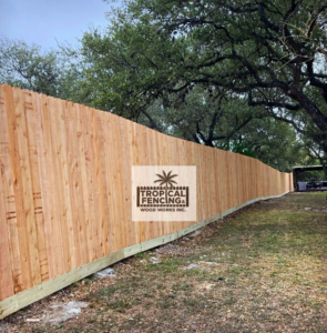 A long section of newly installed wooden privacy fence by Tropical Fencing And Wood Works in Page, TX.