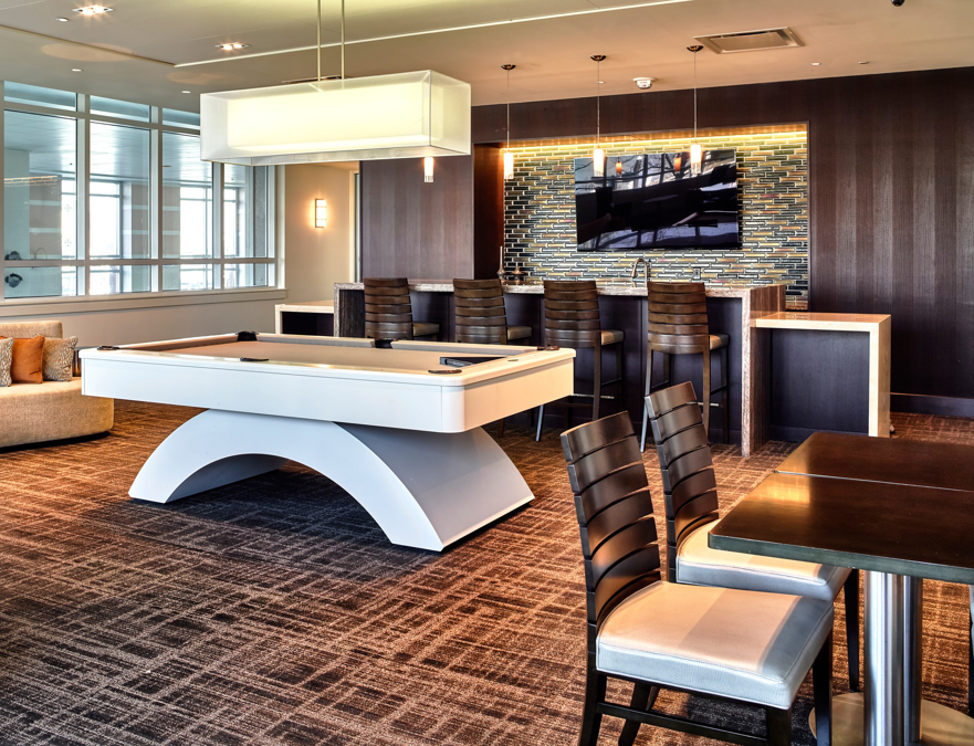 A stylish lounge area featuring a patterned carpet installation by Direct Solutions Flooring in Baltimore, MD.