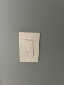 A Lutron smart dimmer switch installed on a wall by Ampler Electrical Services in Wilmington, NC.