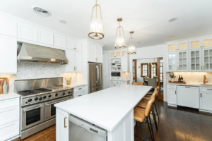 A luxury kitchen featuring elegant pendant lights, under-cabinet lighting, and appliance wiring by Power Plus Electric LLC in Rochester, MN.