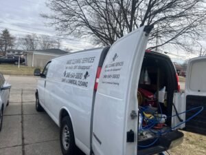 A Magic Cleaning Services van with open doors showing carpet cleaning equipment inside, serving Billerica, MA.