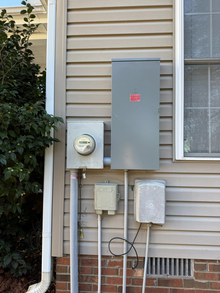 A main electrical service panel and meter installed on the side of a house by C.M.S Electrical in Staley, NC.