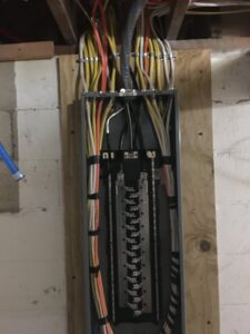 An open main electrical service panel with organized wiring, indicating a professional installation by RHS Electrical Services in Westerville, OH.