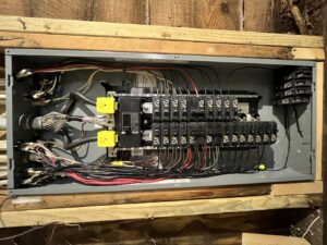 A main electrical service panel with extensive wiring, showcasing work by High Electrical in Atlanta, GA.