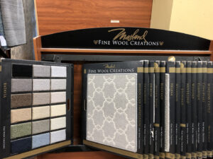 A display of Masland Fine Wool Creations carpet samples in the showroom at Rug Masters in Charleston, SC.