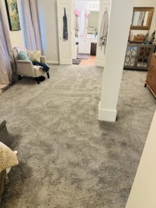 A master bedroom with plush gray carpet installed by Rocky Flooring in Greer, SC.