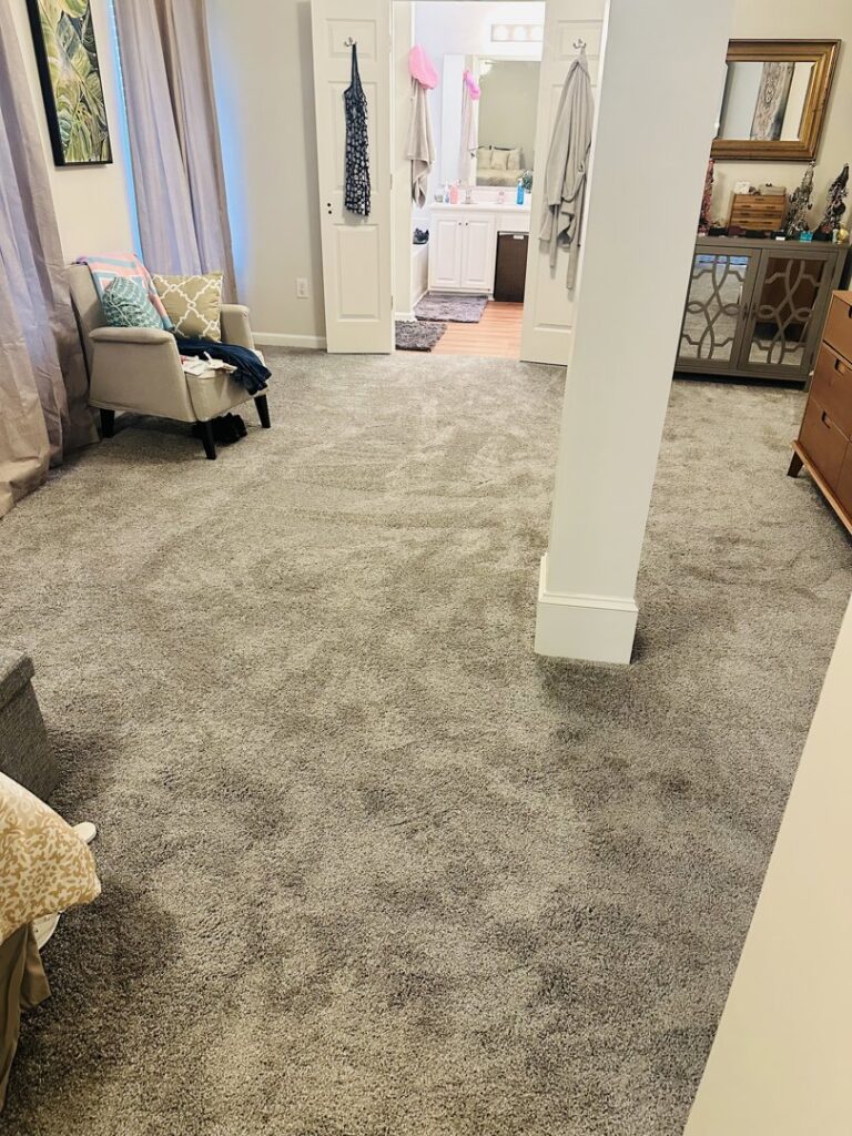 A master bedroom with plush gray carpet installed by Rocky Flooring in Greer, SC.