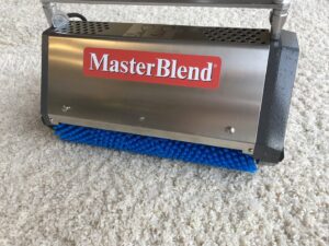 A MasterBlend carpet cleaning machine on a residential carpet, used by Phoenix Tile & Carpet Cleaning in Tempe, AZ.