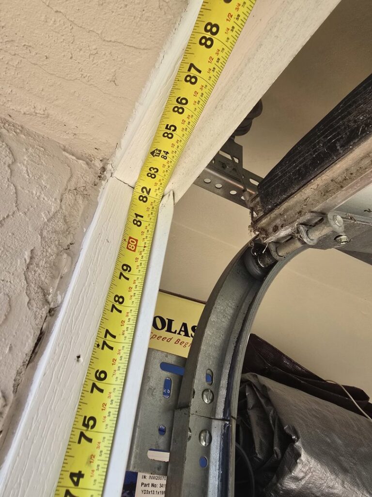 A close-up of a measuring tape against a garage door frame, indicating precise measurements for installation by BSD Garage Door Service in Naperville, IL.