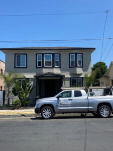 A Mecaf Termite and Pest Control company truck parked in front of a house, ready for a service call in Long Beach, CA