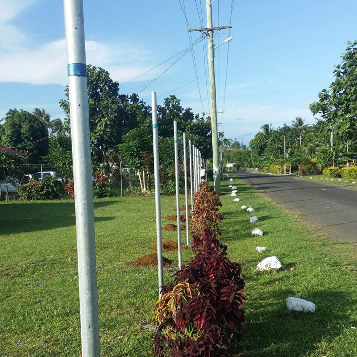 Metal fence posts being installed along a road by Samoa Fencing in Faleata, Apia, Samoa.
