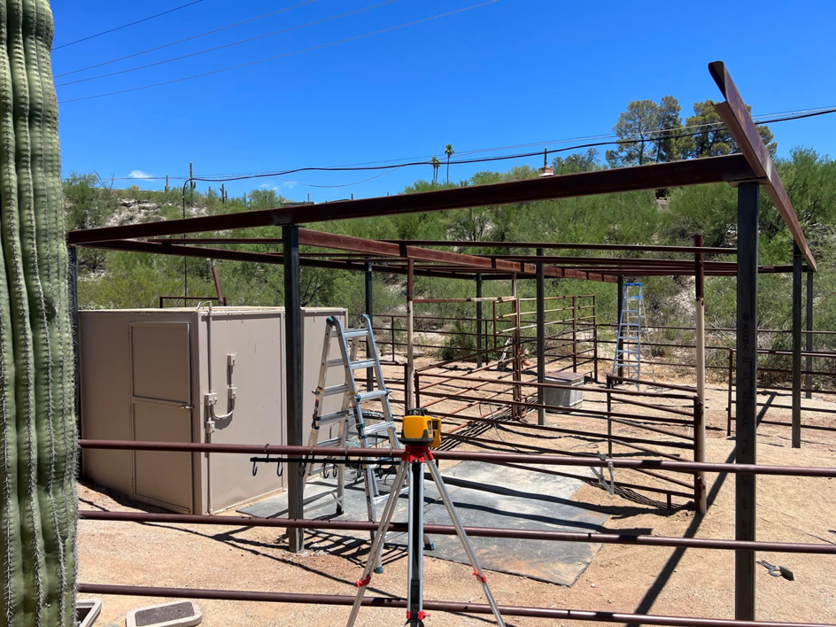 Metal fencing and covered enclosure under construction by TACK Fabrication, showing the framework in Romero, Tucson, AZ.