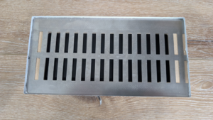 A sleek metal floor vent or register for an HVAC system by BYLT Living in Sandy, UT