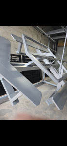 Metal gate and fence components undergoing powder coating at A Master Work Corp. in Hialeah, FL.