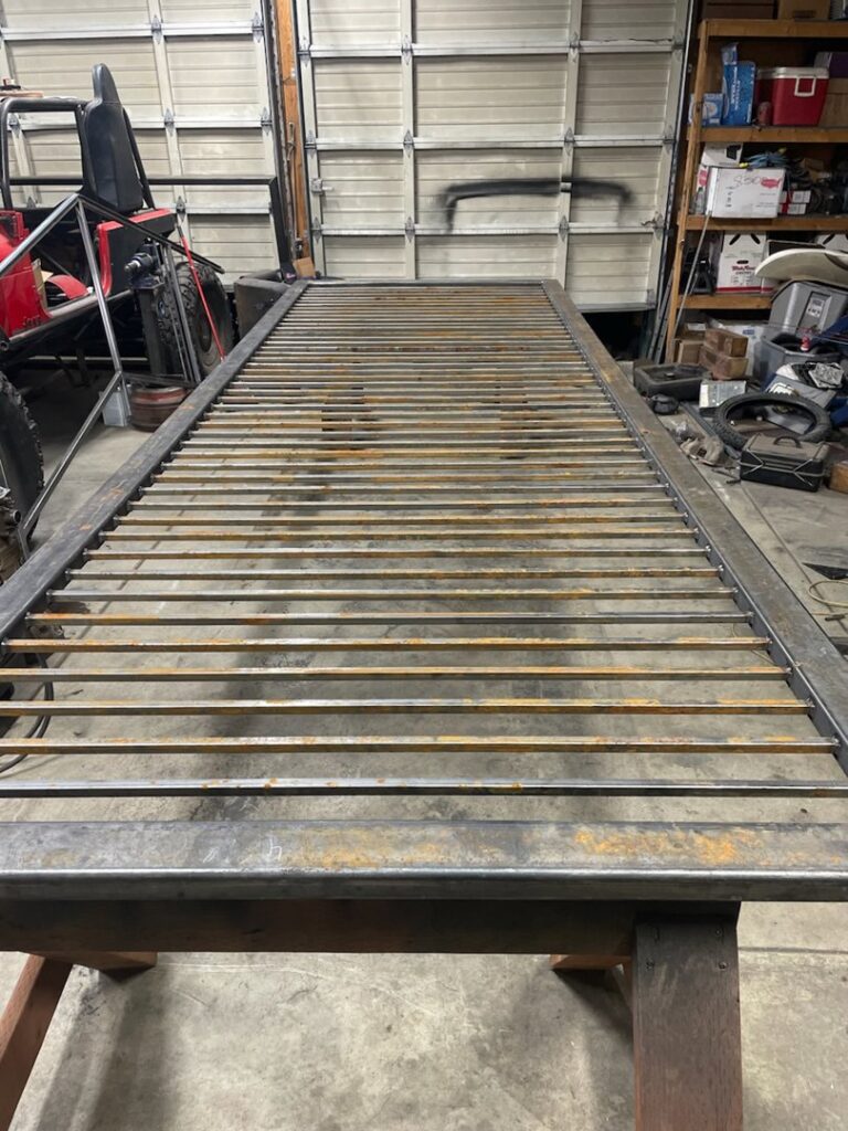 A metal gate frame being fabricated in a workshop by Integrity Gates and Fencing in Yakima, WA