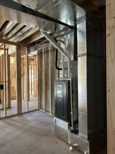 Metal HVAC ductwork and a furnace unit installed in a new home by Cutting Edge HVAC LLC in Orem, UT.