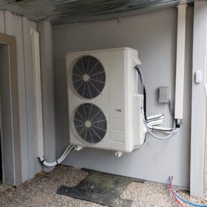 An outdoor mini-split air conditioning condenser unit installed by Reading Plumbing, Heating & Air Conditioning in Roswell, NM