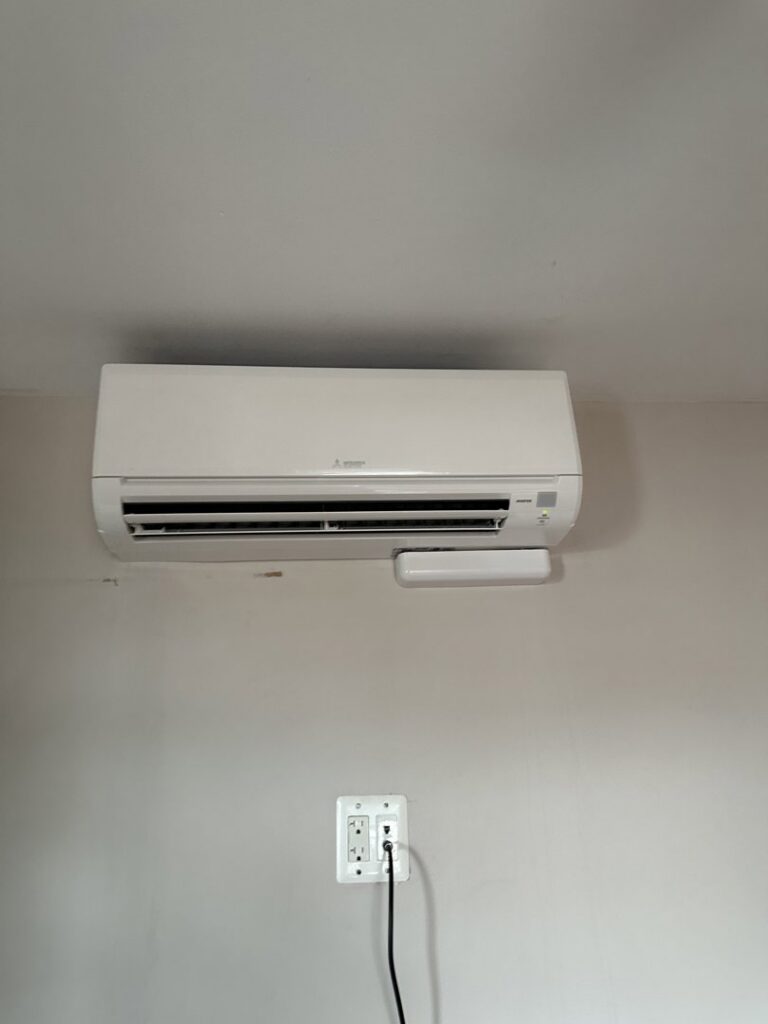 A wall-mounted mini-split AC unit with a dedicated electrical outlet installed by GEN3 Electric & HVAC in Philadelphia, PA.