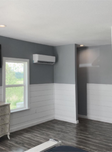 A newly installed mini-split AC unit on a wall, showcasing HVAC installation by Collette Heating Cooling And After Hour Services LLC in Huntsville, AR.