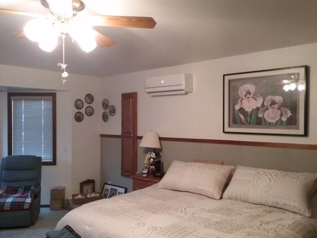 An indoor mini-split air conditioning unit installed in a bedroom by Element Heating & Cooling, Inc. in Twin Falls, ID