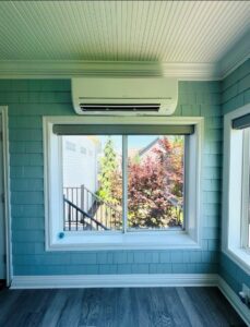 A newly installed mini-split air conditioning unit on a wall by Ideal Heating & Air Conditioning in Omaha, NE.