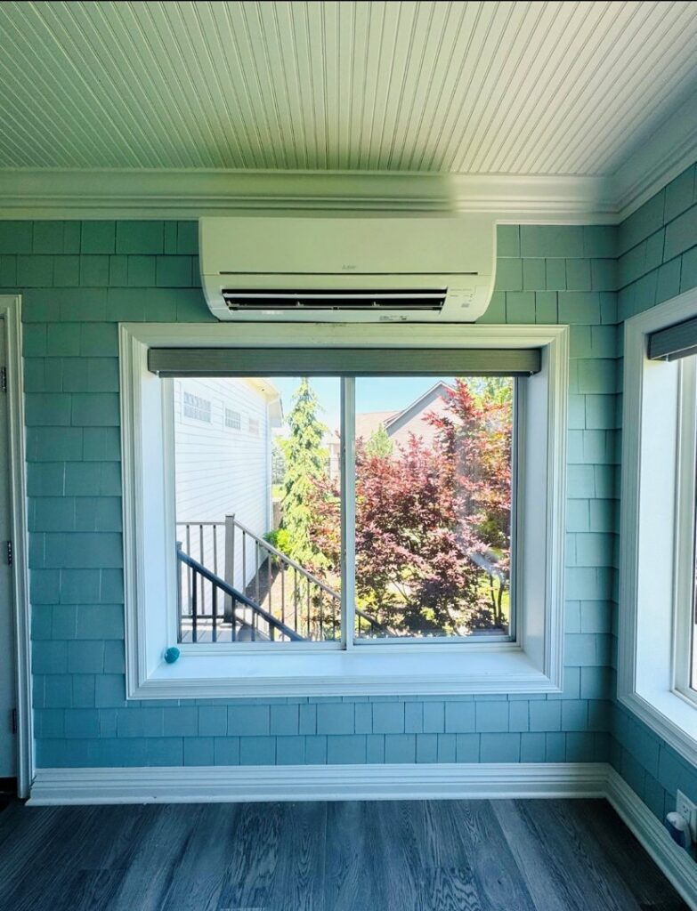 A newly installed mini-split air conditioning unit on a wall by Ideal Heating & Air Conditioning in Omaha, NE.