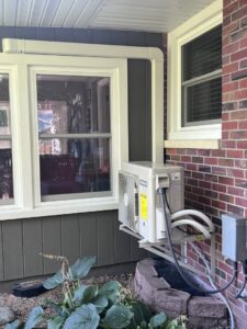 An outdoor mini-split AC unit installed by Action Plumbing, Heating, Air Conditioning & Electrical in Salt Lake City, UT.