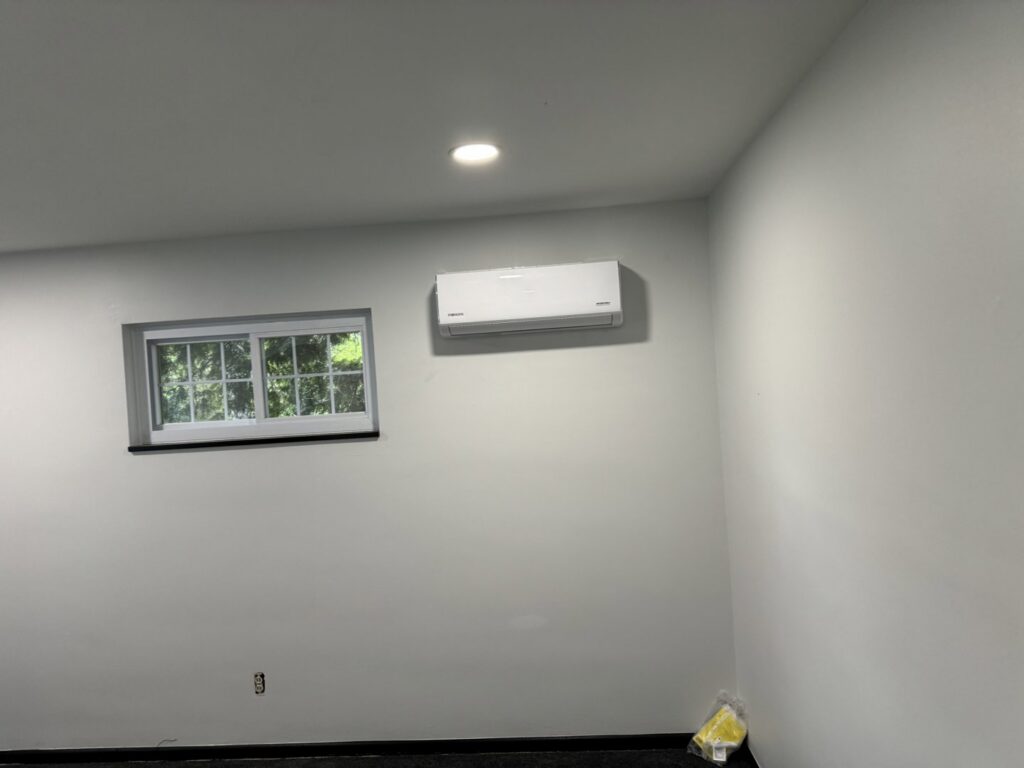 Mini-split air conditioning unit installed on a wall by Breyer's Heating & Air Conditioning in Belleville, MI
