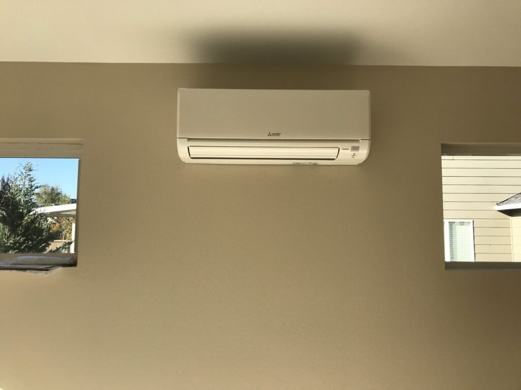 A newly installed mini-split air conditioning unit on a wall by Columbia Heating & Air Conditioning in Kent, WA.