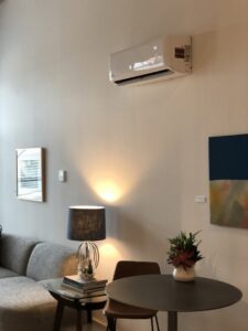 A wall-mounted mini-split AC unit installed in a modern living space by Eagle Heating & A/C in San Antonio, TX.