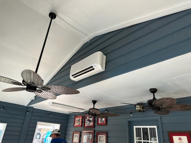 An indoor mini-split air conditioning unit installed on a wall, showcasing services by Netherland Air Conditioning LLC in Mobile, AL.