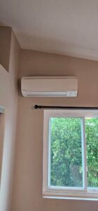 A newly installed mini-split AC unit on a wall, a service provided by Ultimate Air Conditioning in Pearl City, HI