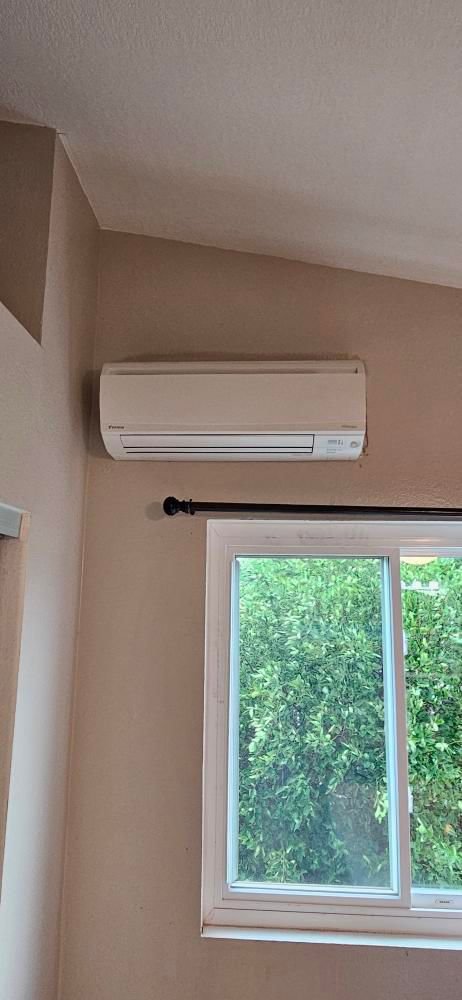 A newly installed mini-split AC unit on a wall, a service provided by Ultimate Air Conditioning in Pearl City, HI