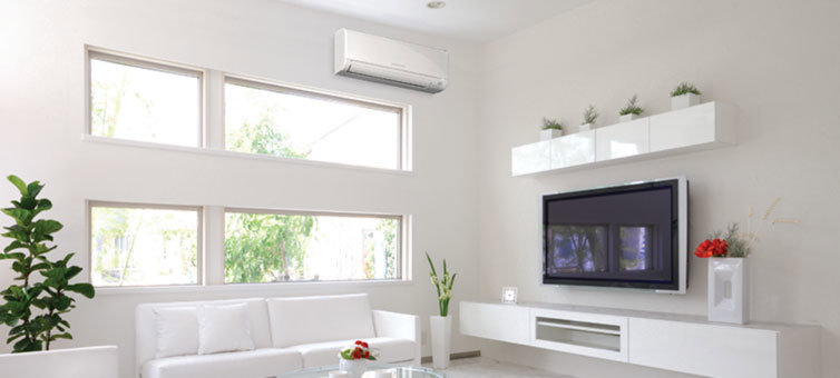 A newly installed mini-split air conditioning unit in a modern living room by Vision Air Services in Tulsa, OK.