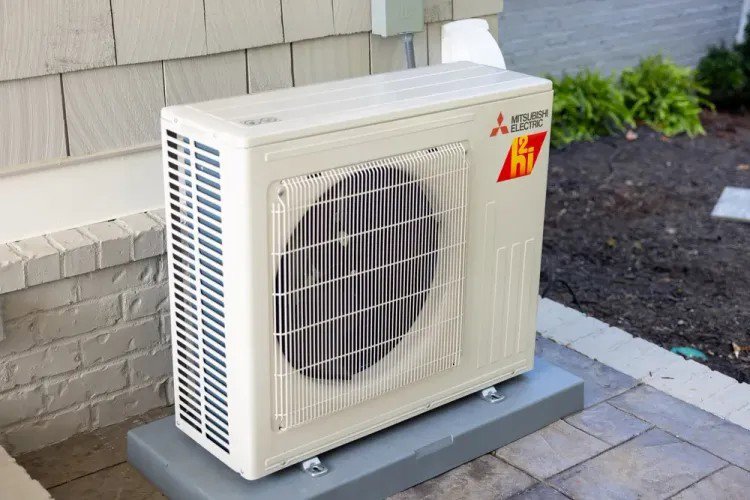 An outdoor Mitsubishi Electric mini-split heat pump unit installed by Crome Mechanical Inc. in Cedar Springs, MI