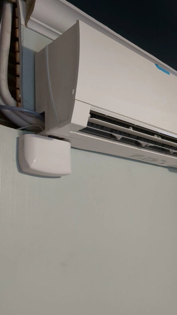 Side view of a mini-split HVAC unit showing refrigerant lines and electrical connections by Gahanna Heating & Cooling, Columbus, OH.