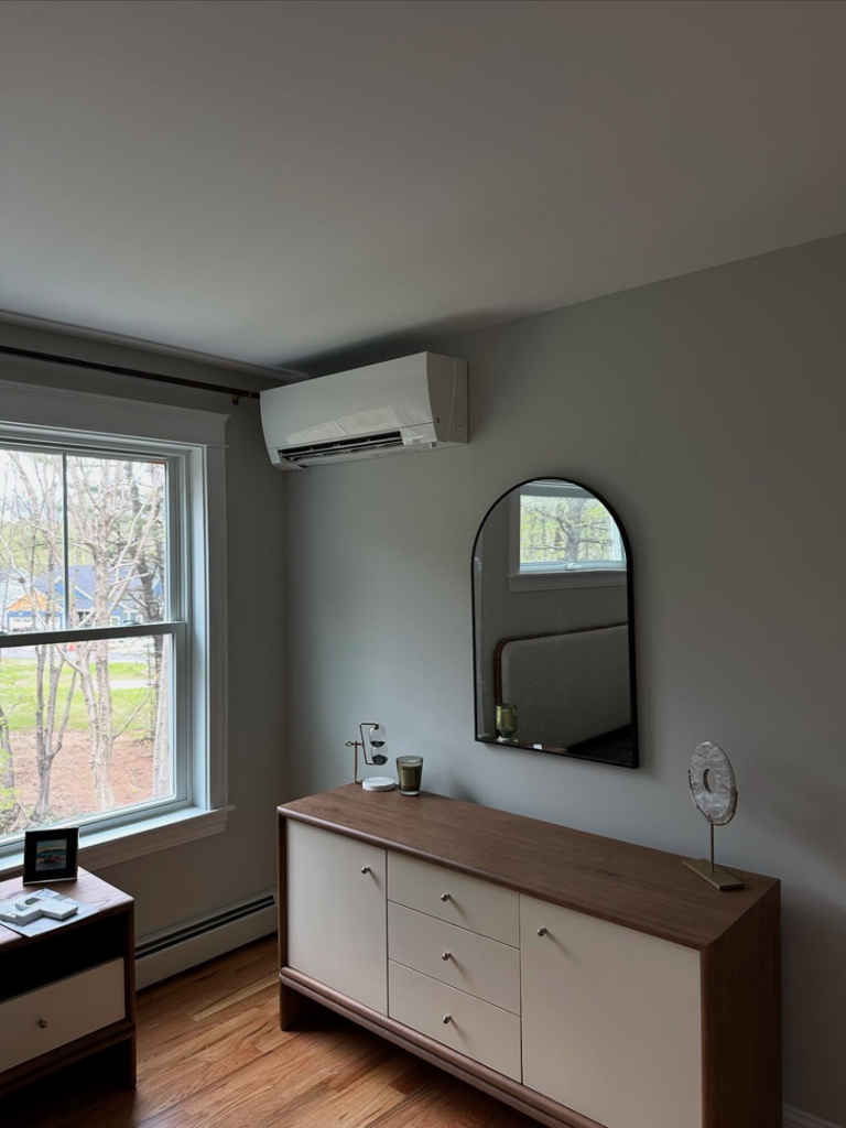 A wall-mounted mini-split HVAC unit installed in a bedroom by Infinity Heating and Cooling in Las Vegas, NV.