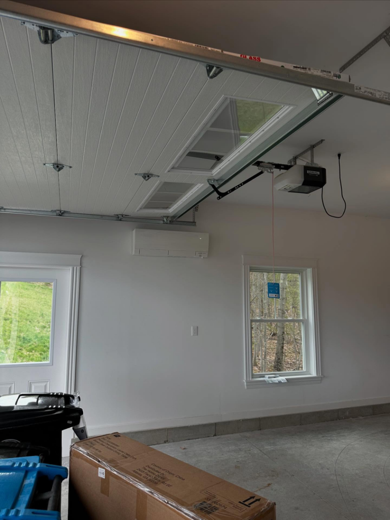 A wall-mounted mini-split HVAC unit installed in a garage by Infinity Heating and Cooling in Las Vegas, NV.