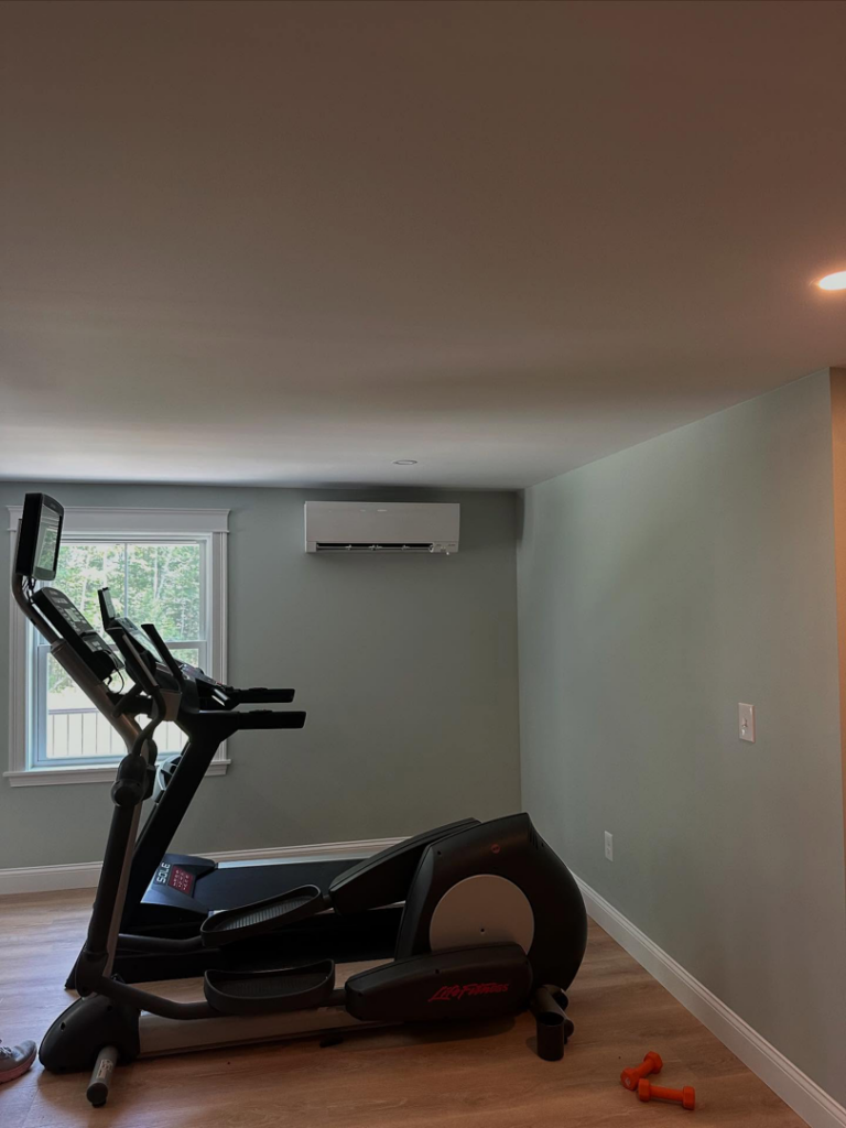 A wall-mounted mini-split HVAC unit installed in a home gym by Infinity Heating and Cooling in Las Vegas, NV.