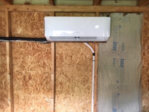 An indoor mini-split HVAC unit installed on a wall by Cool Tech Heating & Cooling in East Peoria, IL.