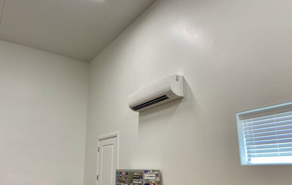 A white mini-split indoor HVAC unit professionally installed on a wall by S&S Mechanical in St. George, UT