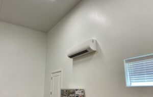 A white mini-split indoor HVAC unit professionally installed on a wall by S&S Mechanical in St. George, UT