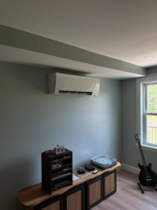 A wall-mounted mini-split HVAC unit installed in a room by Infinity Heating and Cooling in Las Vegas, NV.