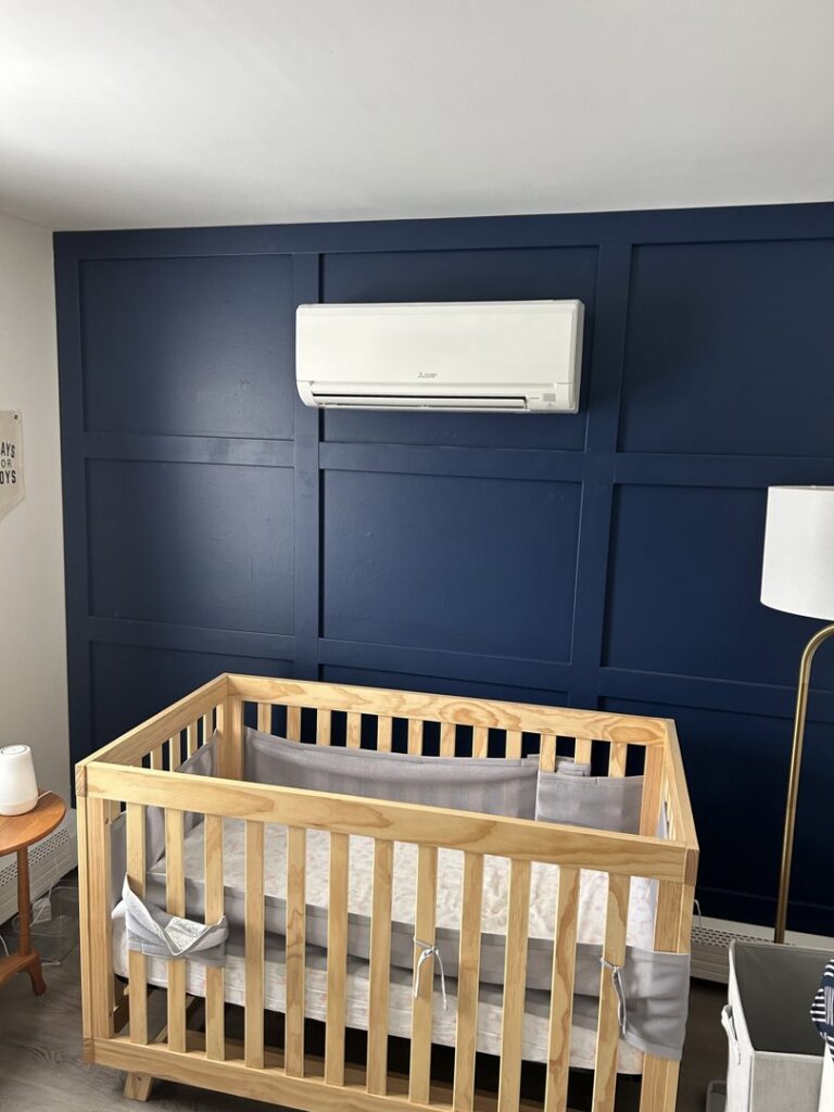 An indoor mini-split head unit installed on a bedroom wall by Climate Diagnostics in Buffalo, NY.