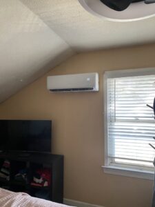 A mini-split indoor unit professionally installed on a bedroom wall by Reasonable Air, LLC in Summerville, SC.