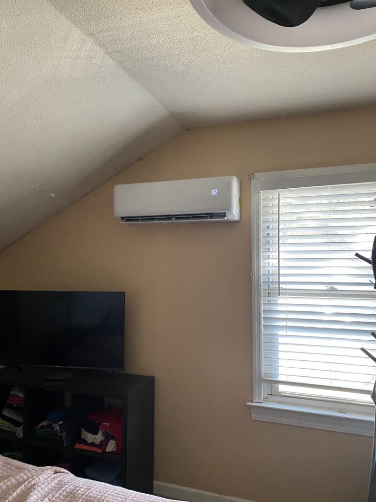 A mini-split indoor unit professionally installed on a bedroom wall by Reasonable Air, LLC in Summerville, SC.