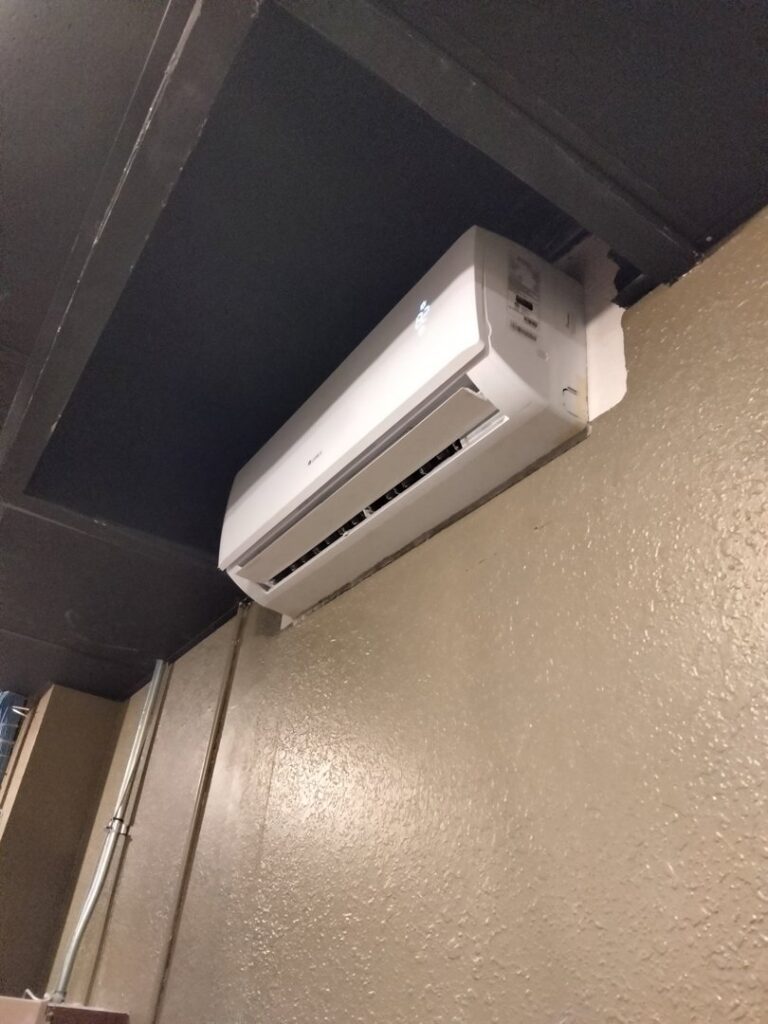 An indoor mini-split air conditioning unit installed on a wall by Avery Heating and Cooling in Independence, MO.