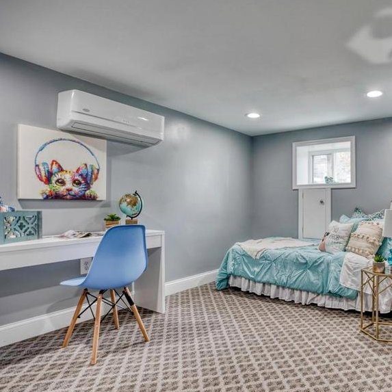 A wall-mounted mini-split indoor unit installed in a room, providing efficient cooling by Simply Home Service in Gaithersburg, MD.
